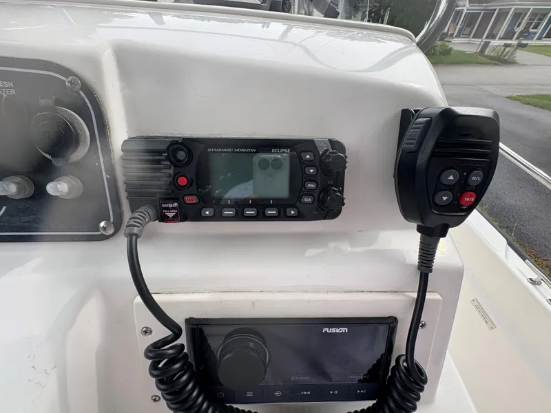 Slide: The Image of 2004 Boston Whaler 220 Dauntless console with radio and control panel. - 3