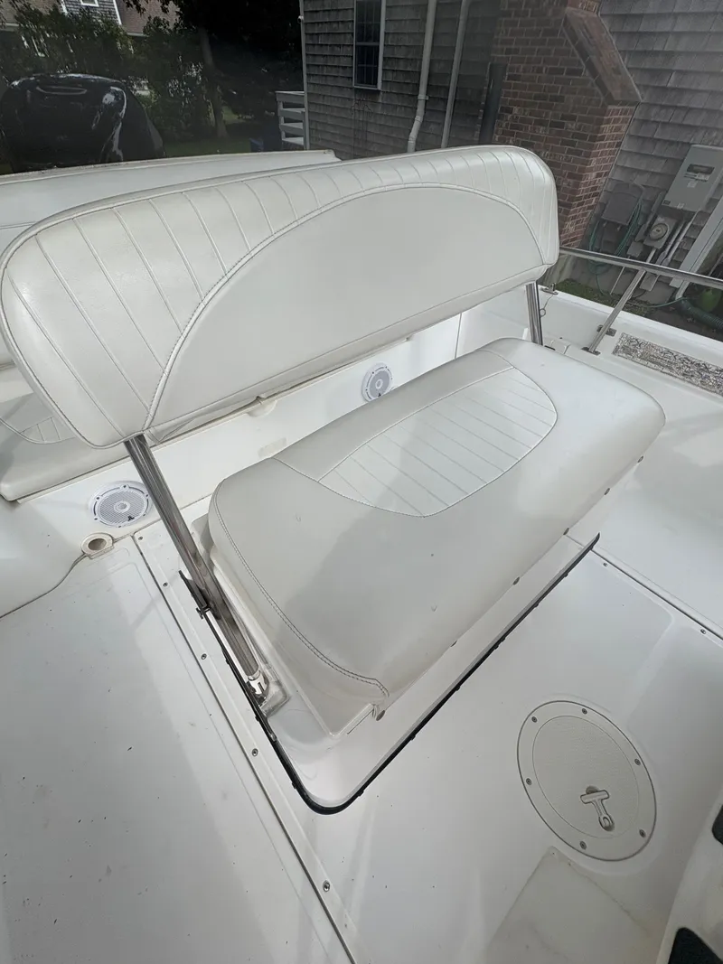 Slide: The Image of White seating on a 2004 Boston Whaler 220 Dauntless boat deck. - 8