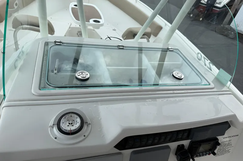 Slide: The Image of 2019 Sailfish 270 CC boat dashboard with compass and control panel. - 11