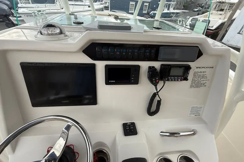Slide: The Image of 2019 Sailfish 270 CC boat dashboard with Garmin and Yamaha electronics. - 15