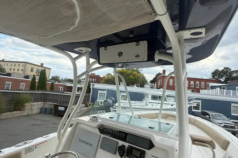 Slide: The Image of 2019 Sailfish 270 CC boat interior with Garmin navigation system and overhead storage. - 22