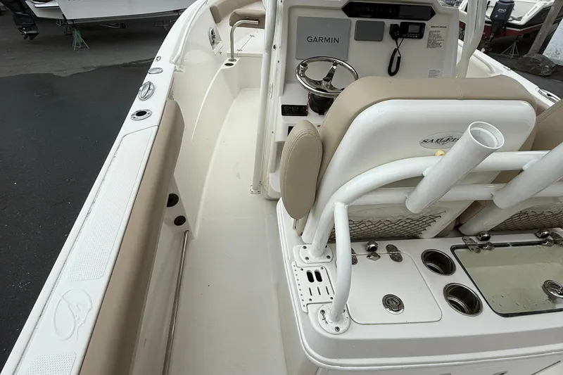 Slide: The Image of 2019 Sailfish 270 CC boat interior with Garmin system and seating. - 7
