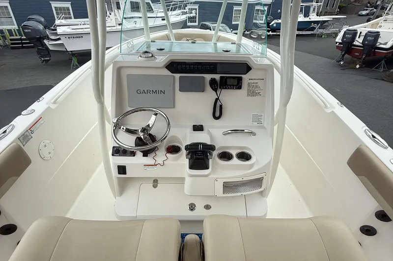Slide: The Image of 2019 Sailfish 270 CC boat console with Garmin navigation and steering wheel. - 9