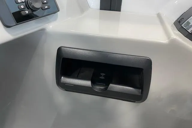 Slide: The Image of 2026 Bentley Pontoons Legacy 223 Navigator interior detail with control panel and storage compartment. - 11