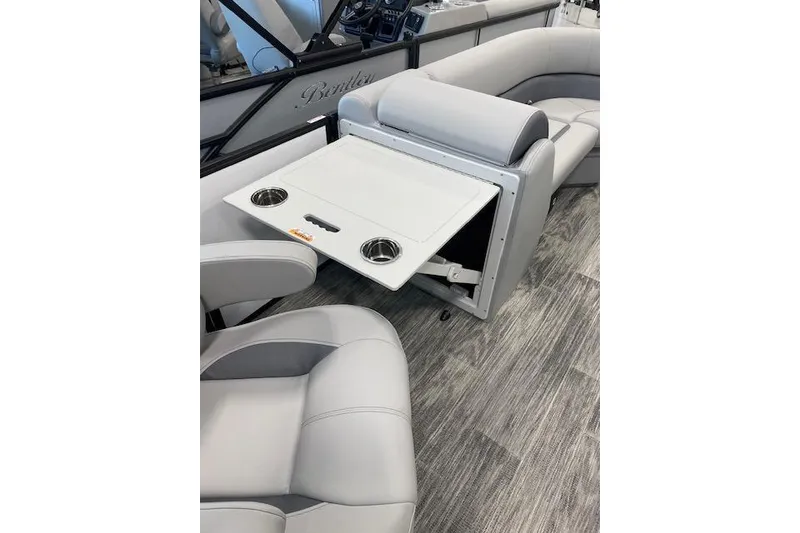 Slide: The Image of 2026 Bentley Pontoons Legacy 223 Navigator interior with foldable table and cup holders. - 13