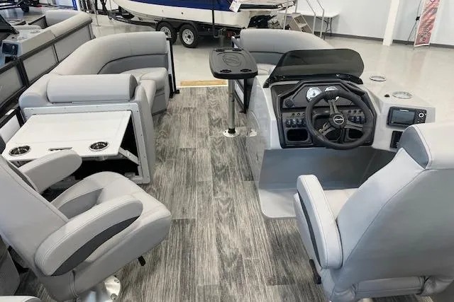 Slide: The Image of 2026 Bentley Pontoons Legacy 223 Navigator interior with modern seating and sleek dashboard design. - 14