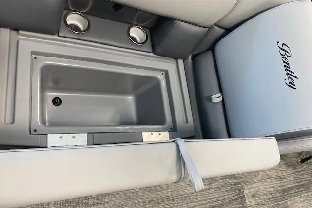 Slide: The Image of Interior of 2026 Bentley Pontoons Legacy 223 Navigator with storage compartment and cup holders. - 17