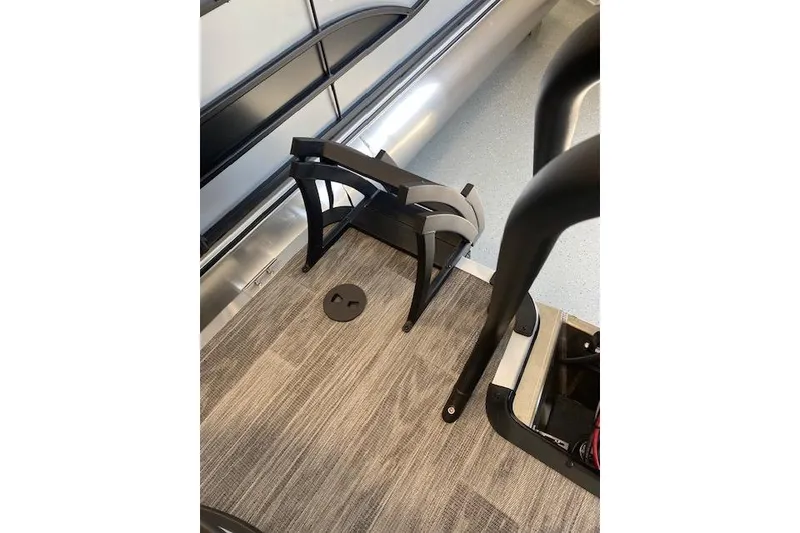 Slide: The Image of 2026 Bentley Pontoons Legacy 223 Navigator interior with modern flooring and sleek design elements. - 18