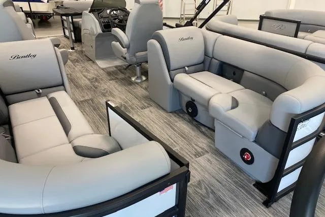 Slide: The Image of 2026 Bentley Pontoons Legacy 223 Navigator interior with luxurious gray seating and modern design. - 21