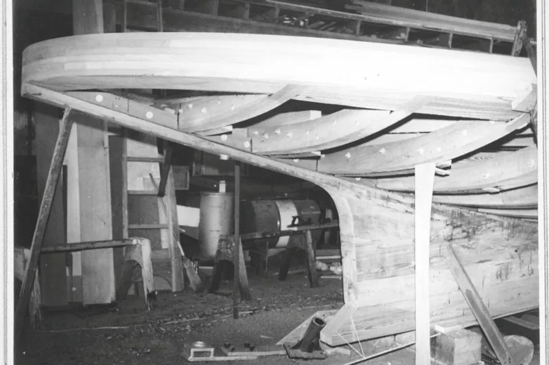 Slide: The Image of Wooden frame of a 1972 custom tug boat under construction in a workshop. - 26