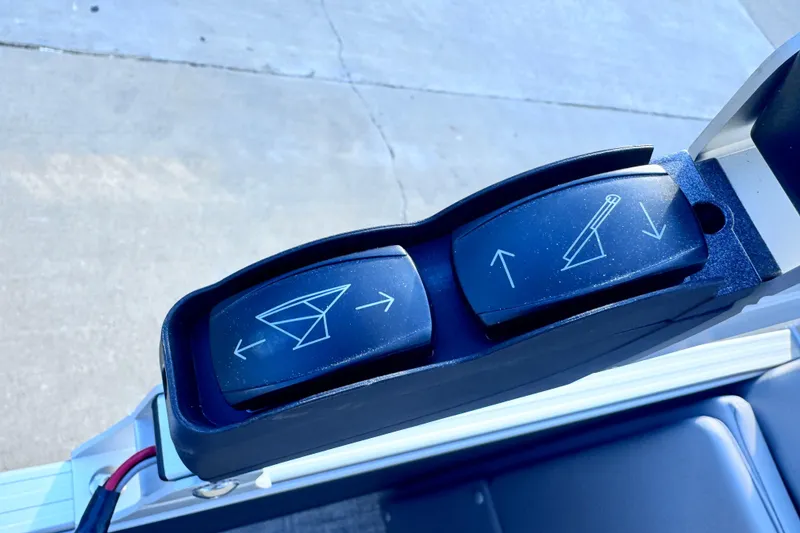 Slide: The Image of Control panel of 2026 Landau Island Breeze 25 boat with directional switches. - 10