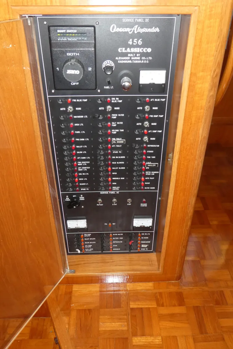 Slide: The Image of Electrical panel of 1992 Ocean Alexander 456 Classicco yacht, featuring various switches and controls. - 13