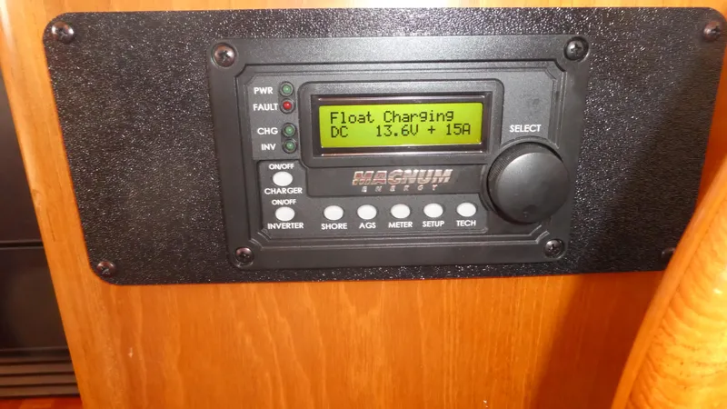 Slide: The Image of Magnum Energy control panel on 1992 Ocean Alexander 456 Classicco, displaying float charging status. - 16