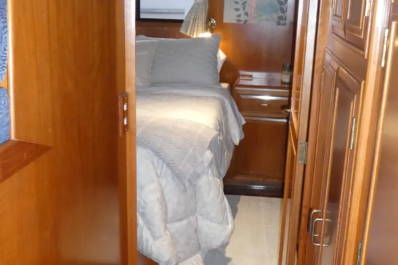 Slide: The Image of Cozy cabin interior of 1992 Ocean Alexander 456 Classicco yacht with wooden furnishings. - 25