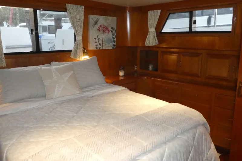 Slide: The Image of Cozy bedroom interior of 1992 Ocean Alexander 456 Classicco yacht with wooden cabinetry. - 31