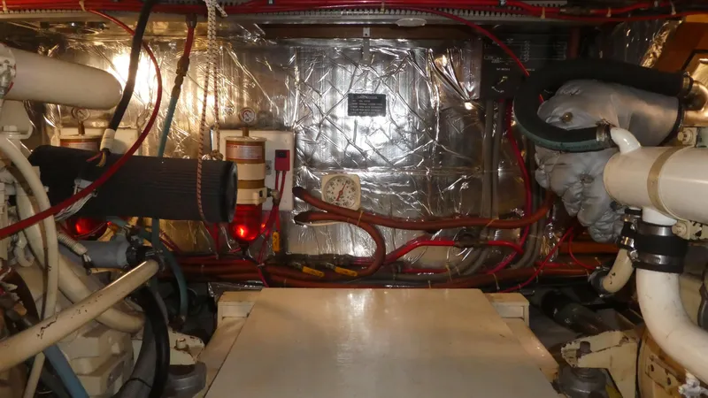 Slide: The Image of Engine room of 1992 Ocean Alexander 456 Classicco yacht, featuring pipes and machinery. - 40