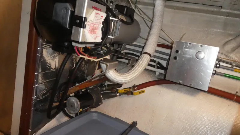 Slide: The Image of Engine room of 1992 Ocean Alexander 456 Classicco with mechanical components and wiring. - 49