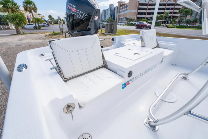 Slide: The Image of 2021 Blazer Bay 2200 boat interior with white seating and Mercury Pro XS engine. - 19