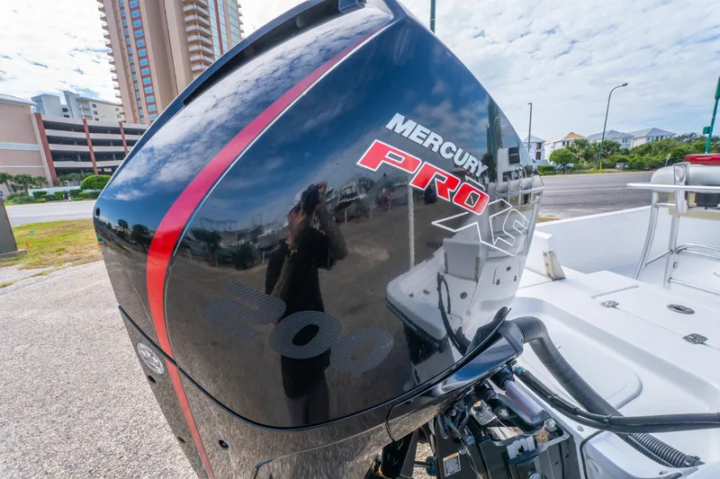 Slide: The Image of 2021 Blazer Bay 2200 with Mercury Pro XS engine, parked near buildings. - 25