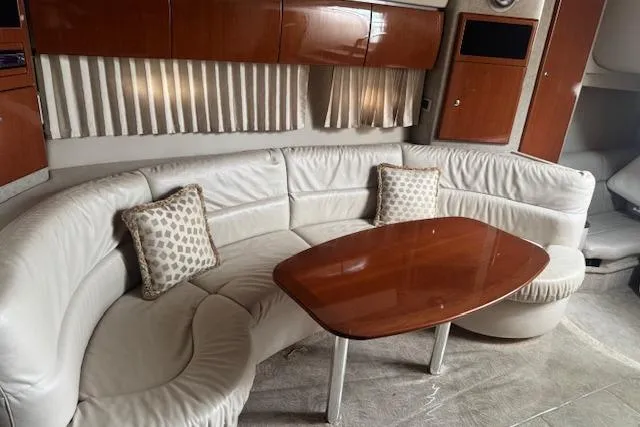 Slide: The Image of Luxurious interior of 2006 Formula 40 Performance Cruiser with white leather seating and wooden table. - 13
