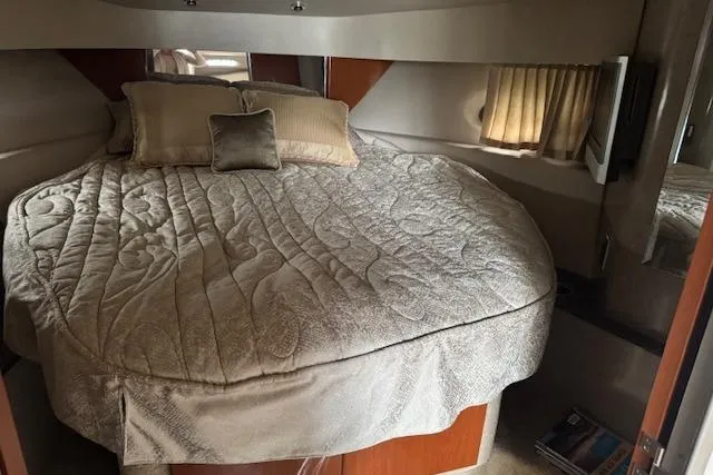 Slide: The Image of Cozy cabin interior of 2006 Formula 40 Performance Cruiser with plush bedding and soft lighting. - 14