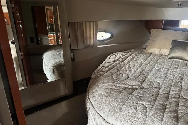 Slide: The Image of 2006 Formula 40 Performance Cruiser cabin with cozy bed and porthole window. - 15