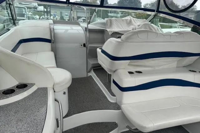 Slide: The Image of 2006 Formula 40 Performance Cruiser interior with white and blue seating, spacious cockpit area. - 8