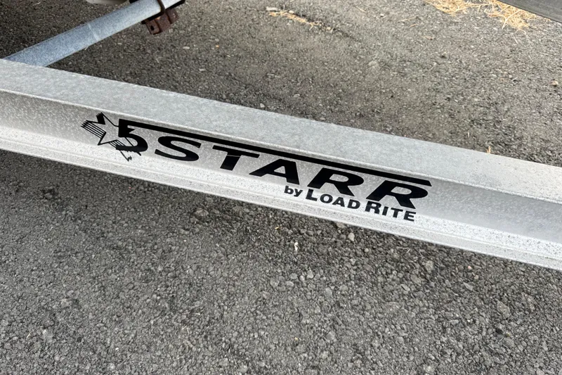 Slide: The Image of Trailer frame with "Starr by Load Rite" branding on asphalt surface. - 5