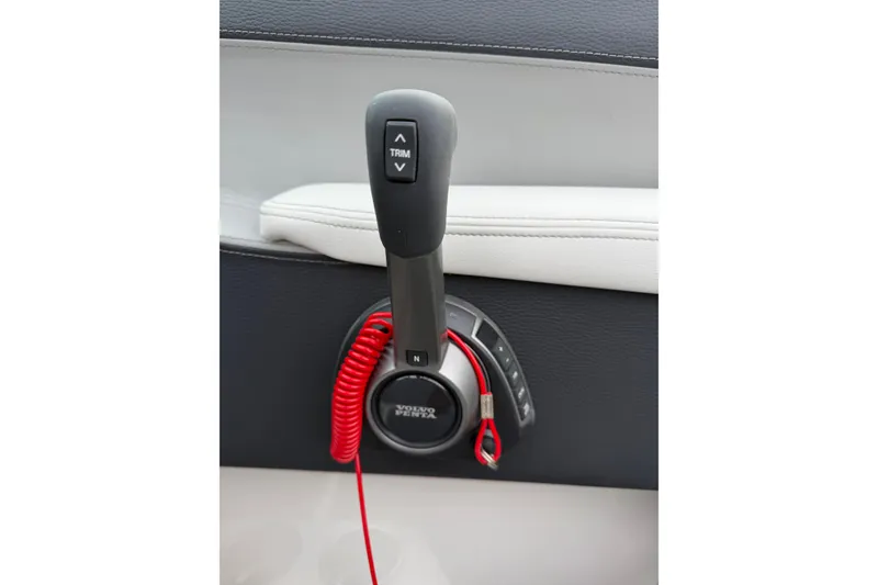 Slide: The Image of Throttle control of 2026 Regal LS2 Surf boat with Volvo Penta branding. - 18