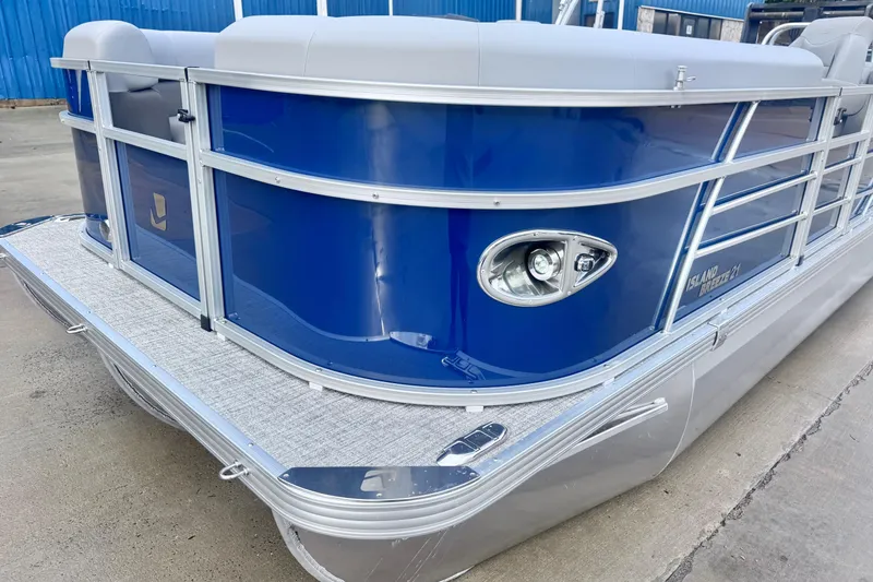 Slide: The Image of 2026 Landau ISLAND BREEZE 21 pontoon boat with sleek blue exterior and modern design. - 2