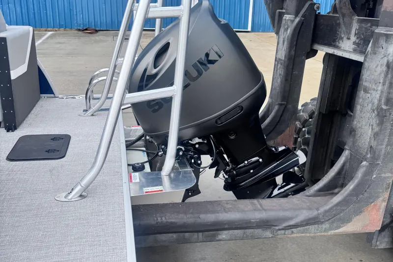 Slide: The Image of 2026 Landau ISLAND BREEZE 21 with Suzuki outboard motor on a trailer. - 6