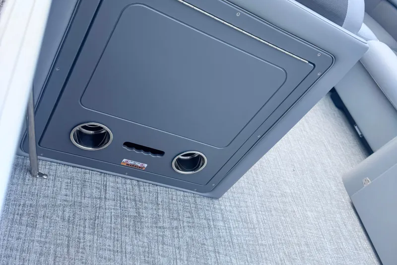 Slide: The Image of Interior of 2026 Landau ISLAND BREEZE 21 with cup holders and storage compartment. - 7