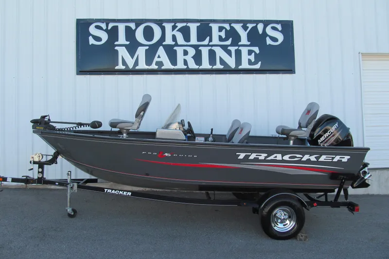 Slide: The Image of 2016 Tracker Pro Guide V-16 SC boat with Mercury engine on trailer. - 2