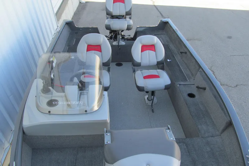 Slide: The Image of 2016 Tracker Pro Guide V-16 SC boat interior with seating and console. - 7