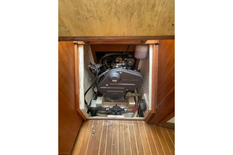 Slide: The Image of Engine compartment of a 2002 Tartan 37 sailboat, featuring a Yanmar engine. - 10