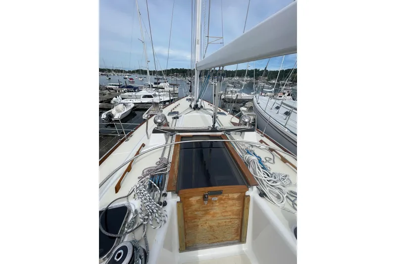 Slide: The Image of Sailboat deck view of 2002 Tartan 37, docked in a marina. - 23