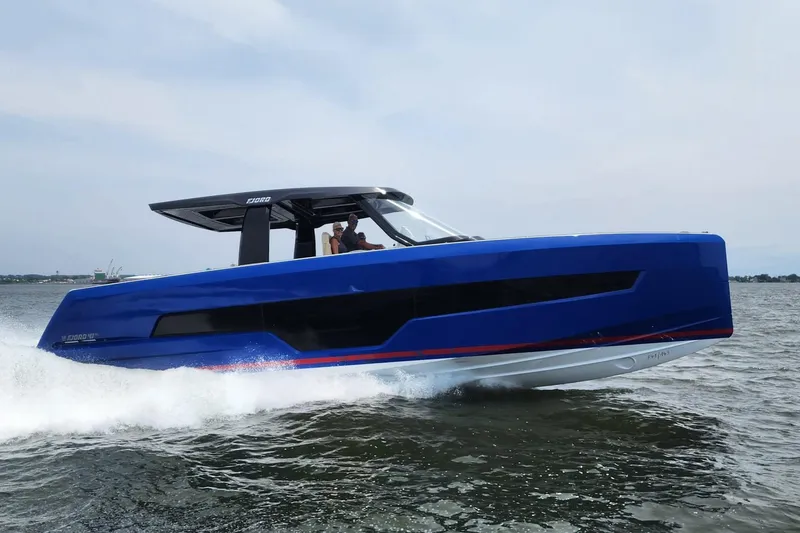 The Image of 2023 Fjord 41 XL yacht cruising on open water, showcasing sleek blue design. - 1
