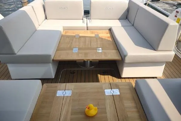 Slide: The Image of Luxurious seating area on 2023 Fjord 41 XL yacht with wooden table and rubber duck. - 21