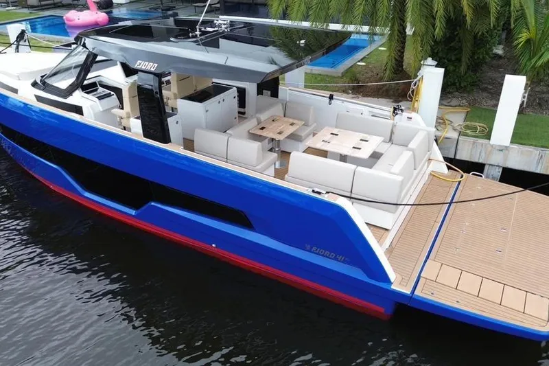 Slide: The Image of 2023 Fjord 41 XL yacht with sleek design, spacious deck, and modern seating area. - 3