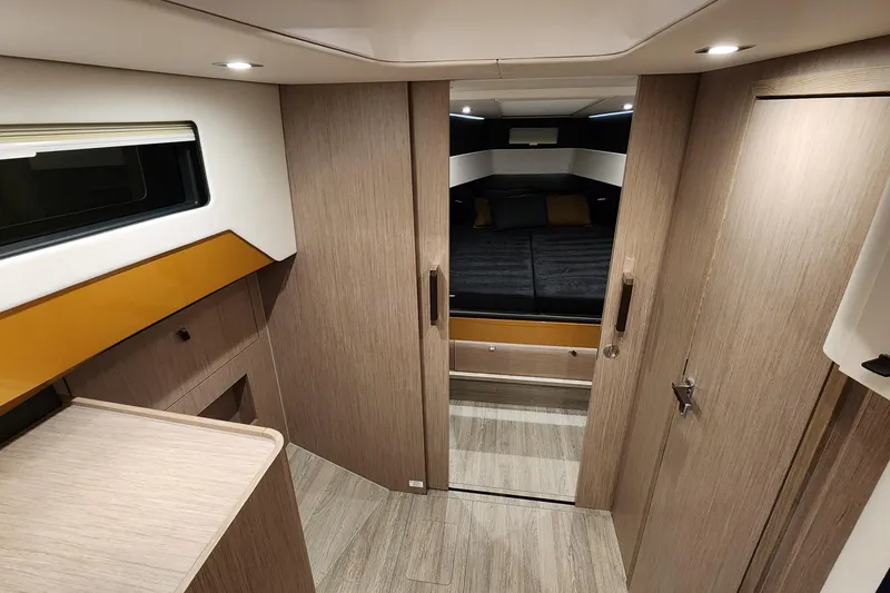 Slide: The Image of 2023 Fjord 41 XL interior cabin with modern wood finish and cozy sleeping area. - 30