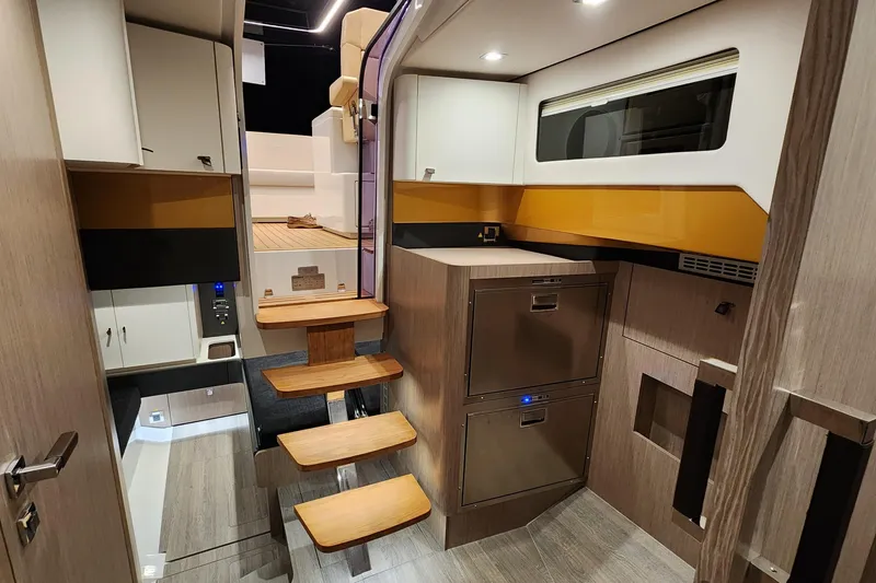 Slide: The Image of Modern interior of 2023 Fjord 41 XL yacht with wooden steps and sleek cabinetry. - 31