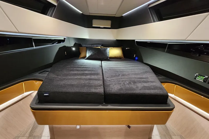 Slide: The Image of Luxurious interior cabin of 2023 Fjord 41 XL yacht with modern bedding and ambient lighting. - 32
