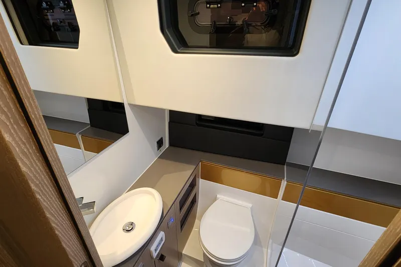 Slide: The Image of Modern bathroom interior of 2023 Fjord 41 XL yacht, featuring sleek design and compact amenities. - 33