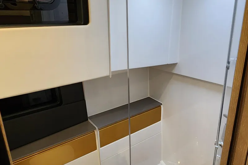 Slide: The Image of Modern interior of 2023 Fjord 41 XL yacht, featuring sleek cabinetry and minimalist design. - 34