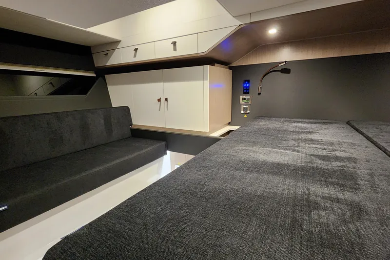 Slide: The Image of 2023 Fjord 41 XL interior cabin with modern design, featuring seating and storage. - 36