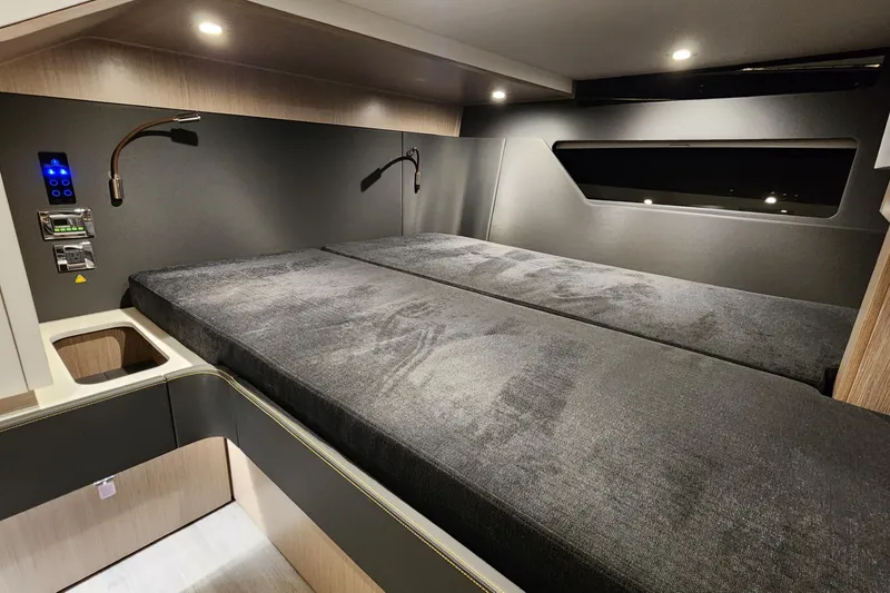 Slide: The Image of 2023 Fjord 41 XL cabin interior with modern bed and ambient lighting. - 38