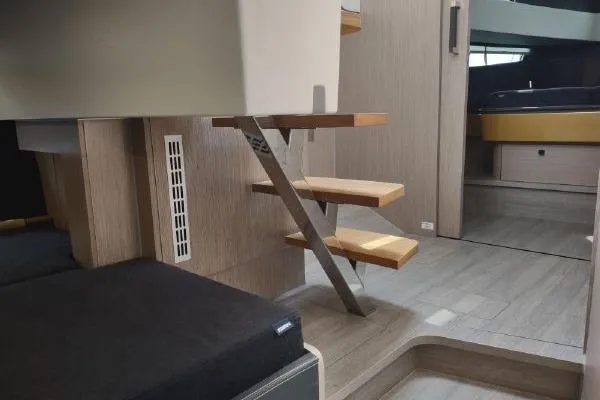 Slide: The Image of Modern interior of 2023 Fjord 41 XL yacht with sleek wooden stairs and stylish design. - 41
