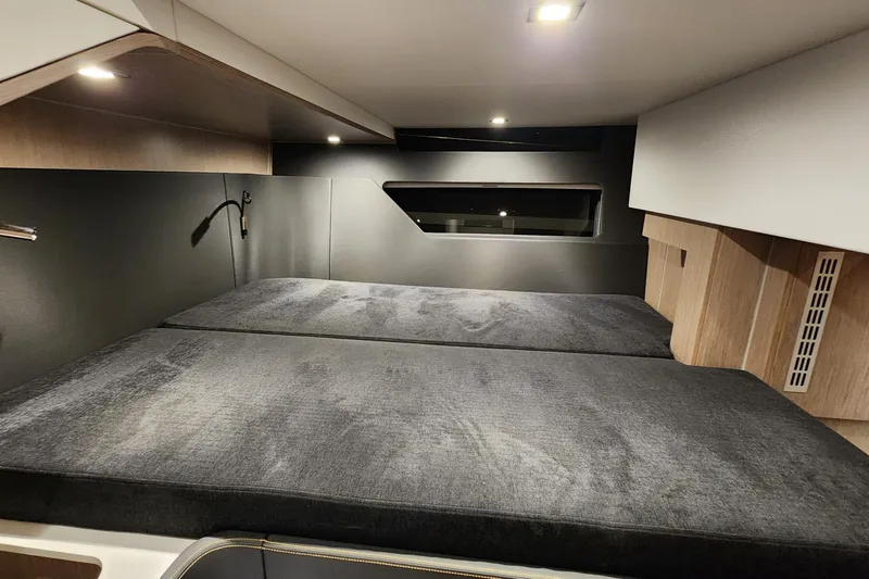 Slide: The Image of 2023 Fjord 41 XL cabin interior with modern design and comfortable bedding. - 42