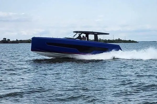Slide: The Image of 2023 Fjord 41 XL boat cruising on open water, showcasing sleek design and performance. - 8