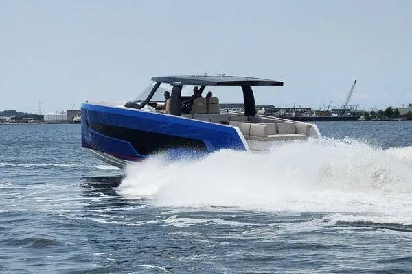 Slide: The Image of 2023 Fjord 41 XL yacht cruising swiftly on open water, showcasing sleek design and luxury. - 9